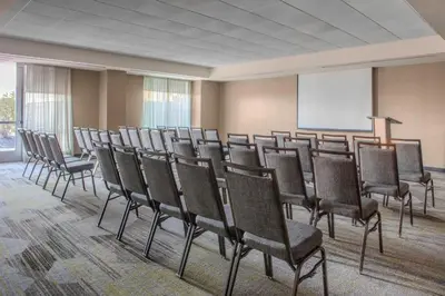 a room with a bunch of chairs and a whiteboard at Courtyard by Marriott Yonkers Westchester County in Yonkers