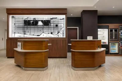 a store with wooden counters and a large window at Courtyard by Marriott New York Manhattan Upper East Side in New York
