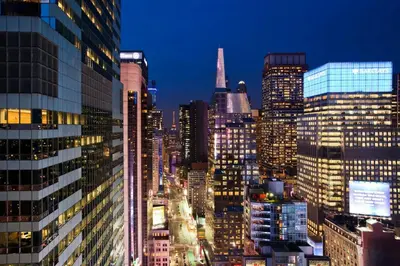 a view of a city skyline at night at W New York - Times Square in New York