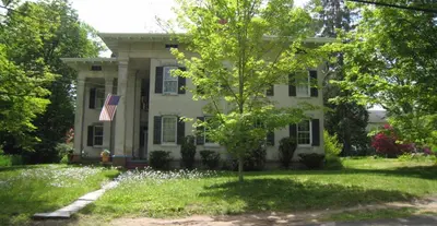 a house with a tree in front of it at Higganum House B&B in Higganum