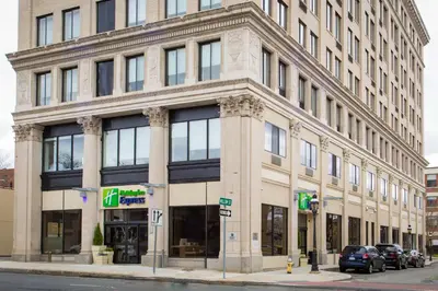 a large building on the corner of a street at Holiday Inn Express - Springfield Downtown by IHG in Springfield