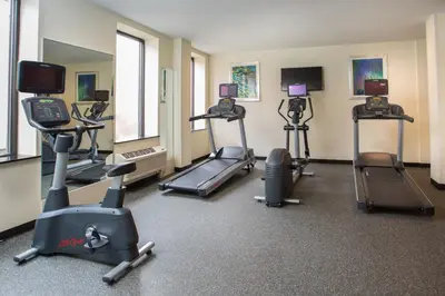 a gym with several exercise bikes in a room at Holiday Inn Express - Springfield Downtown by IHG in Springfield