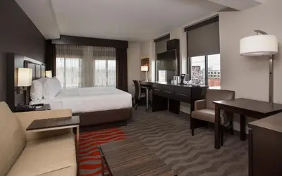 a hotel room with a bed and a desk at Holiday Inn Express - Springfield Downtown by IHG in Springfield