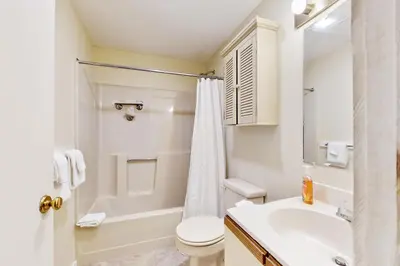 a bathroom with a white toilet and a sink at Valley View: Forest Edge 189 in Dover