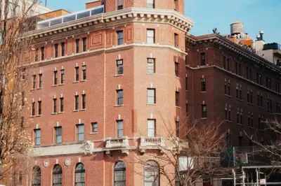 a red brick building with a tower on top of it at West Village Eurohostel in New York