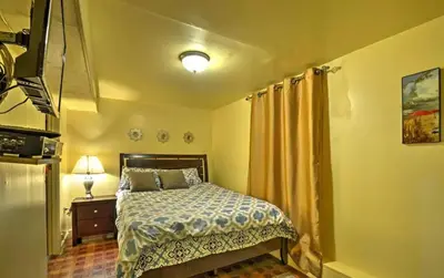 a bedroom with a bed and a television in it at Two Bedroom Apartment - North East Bronx in Bronx