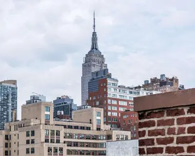a view of the empire state building from the city at The Moore, New York City, a Member of Design Hotels in New York