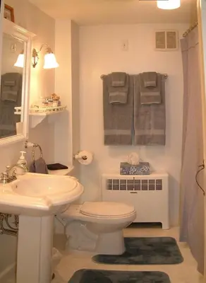 a bathroom with a white toilet and a sink at Truman Gillet House B & B in Granby