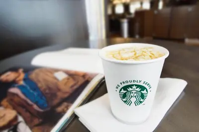 a cup of coffee sitting on a table at Courtyard by Marriott Lenox Berkshires in Lenox