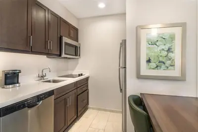 a kitchen with a sink and a counter top at Homewood Suites By Hilton Schenectady in Schenectady