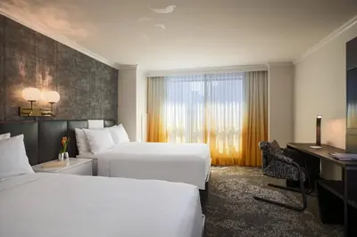 a hotel room with two beds and a window at Renaissance New York Times Square by Marriott in New York