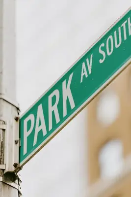 a green street sign that reads park south at Hotel Park Ave NYC in New York