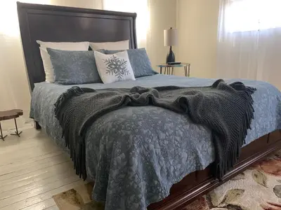 a bedroom with a large bed with pillows at The Country Inn in Stone Ridge