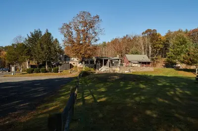 a park with a fence in the middle of a field at The Country Inn in Stone Ridge