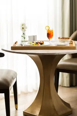 a table with a tray of food on top of it at Delamar West Hartford in West Hartford