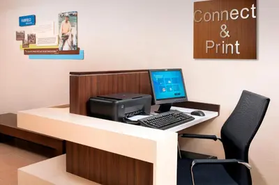 an office with a desk with a computer and a printer at Fairfield Inn & Suites by Marriott Albany East Greenbush in East Greenbush