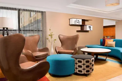a waiting room with chairs and a couch at Fairfield Inn & Suites by Marriott Albany East Greenbush in East Greenbush