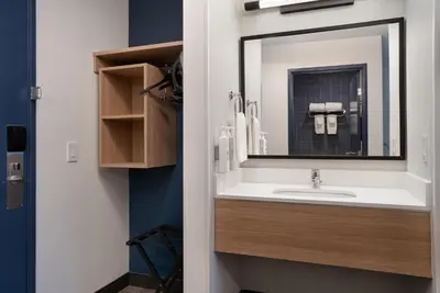 a bathroom with a sink and a mirror at Spark by Hilton West Coxsackie in West Coxsackie