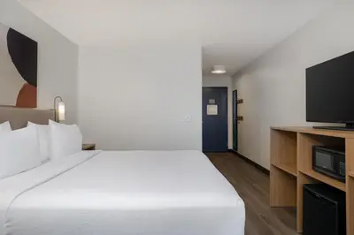 a hotel room with a bed and a tv at Spark by Hilton West Coxsackie in West Coxsackie