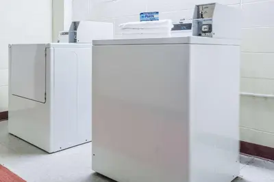 two white refrigerators sitting next to each other at Days Inn by Wyndham Berlin Meriden in Berlin