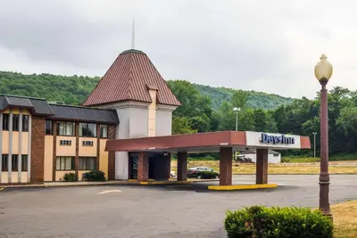 a building with a sign on the front of it at Days Inn by Wyndham Berlin Meriden in Berlin