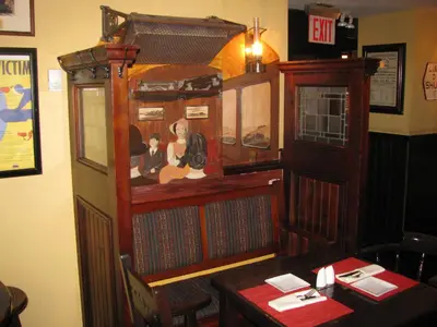 a restaurant dining room with a table and a booth at Fitzpatrick Grand Central in New York