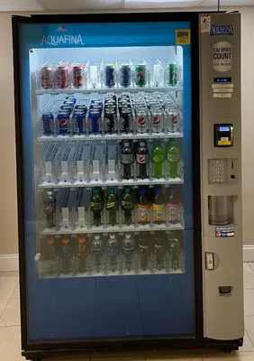 a vending machine filled with lots of drinks at Baymont by Wyndham Latham Albany Airport in Latham