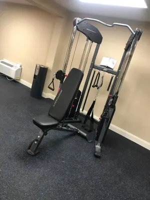 a gym chair with a treadmill in a room at Baymont by Wyndham Latham Albany Airport in Latham
