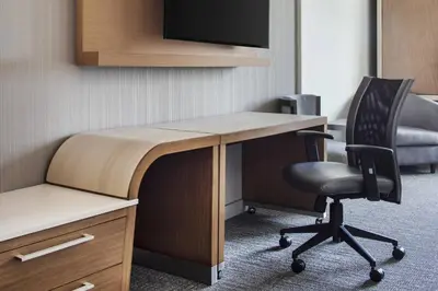 an office with a desk with a chair and a monitor at Courtyard by Marriott Wayne Fairfield in Wayne