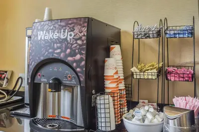a coffee maker sitting on top of a counter at Comfort Inn & Suites LaGuardia Airport in Queens