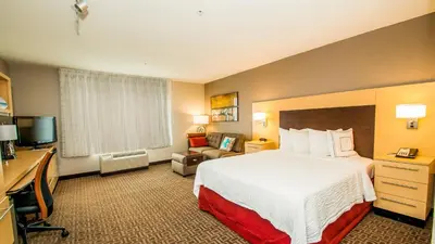 a hotel room with a bed and a television at TownePlace Suites by Marriott Scranton Wilkes-Barre in Moosic