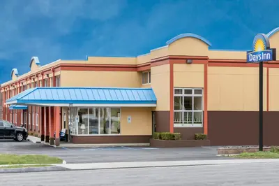 a mcdonalds restaurant with a sign in front of it at Days Inn by Wyndham Albany SUNY in Albany