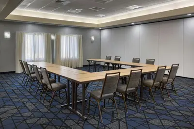 a conference room with a long table and chairs at Courtyard by Marriott New Haven Orange in Orange