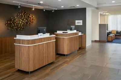 a lobby with a reception desk and a waiting room at Courtyard by Marriott New Haven Orange in Orange