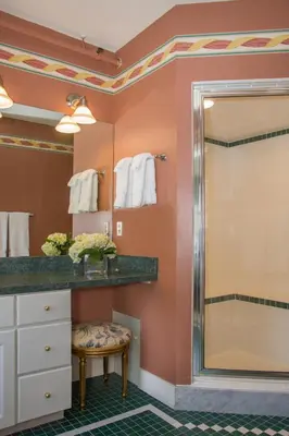 a bathroom with a sink and a mirror at The INN at Ormsby Hill in Manchester