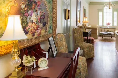 a living room with a table and a painting on the wall at Daniel Stebbins B and B in South Hadley