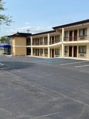 an empty parking lot in front of a hotel at Executive Inn Schenectady Downtown in Schenectady