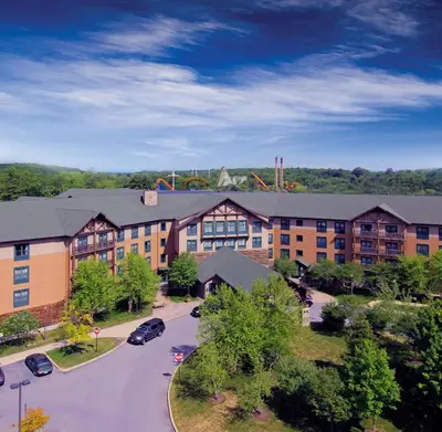 an aerial view of a building with a parking lot at Six Flags Great Escape Lodge & Indoor Waterpark in Queensbury