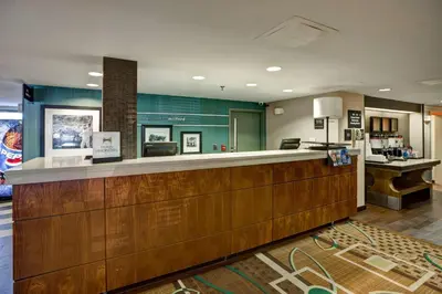 a lobby of a hotel with a reception counter at Hampton Inn by Hilton Milford in Milford