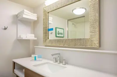 a bathroom with a sink and a mirror at Hampton Inn Fishkill in Fishkill