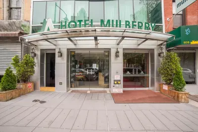 an entrance to a hotel millery with a sign on it at Hotel Mulberry in New York