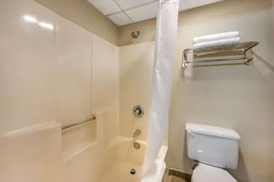 a bathroom with a toilet and a shower at Comfort Inn & Suites East Hartford - Hartford in East Hartford