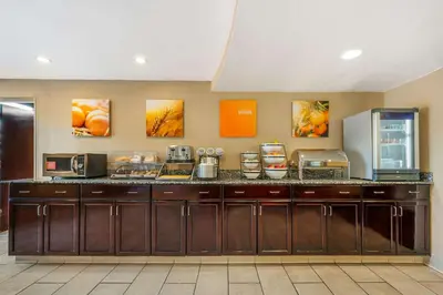 a kitchen with a counter with some food on it at Comfort Inn & Suites East Hartford - Hartford in East Hartford
