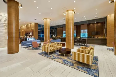 a lobby of a hotel with chairs and a bar at Sheraton Tribeca New York Hotel in New York