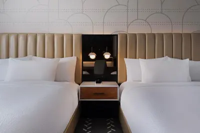 two beds sitting next to each other in a room at Courtyard by Marriott New York Manhattan / Soho in New York