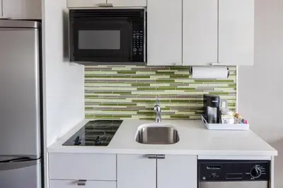 a kitchen with a sink and a microwave at Element Times Square West in New York