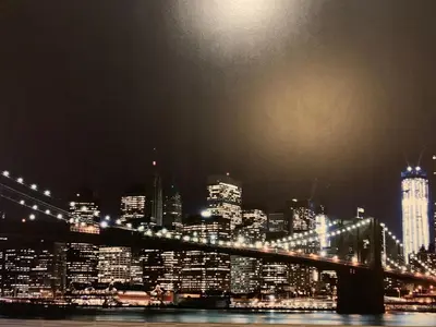 a view of a city at night with a bridge at Red Carpet Inn Elmwood in Elmwood Park