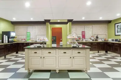 a large kitchen with a large island in a room at Hampton Inn & Suites Albany-Airport in Latham