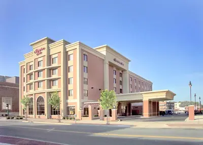 a large building on the corner of a street at Hampton Inn Schenectady Downtown in Schenectady