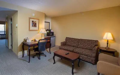 a living room with a couch and a table at Hampton Inn Bennington in Bennington